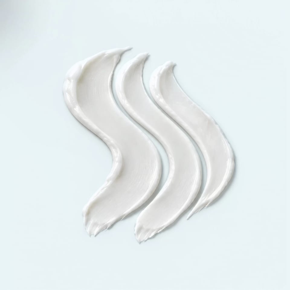 Three ribbons of cream side by side, an illustration of the three lipids