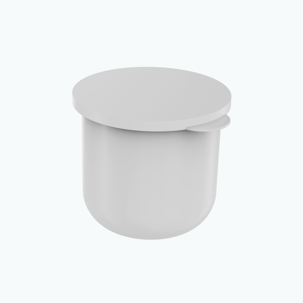 A minimalist, matte white cylindrical container with a matching lid and a small side tab, shown on a clean white background.