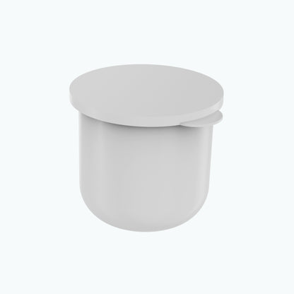 The white inner refill pod that drops into the Zerafite Skin Brightening Barrier Cream jar, its flat lid tilted off.