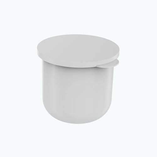 A single white Zerafite Skin Brightening Barrier Cream refill pod with its flat lid resting on top.